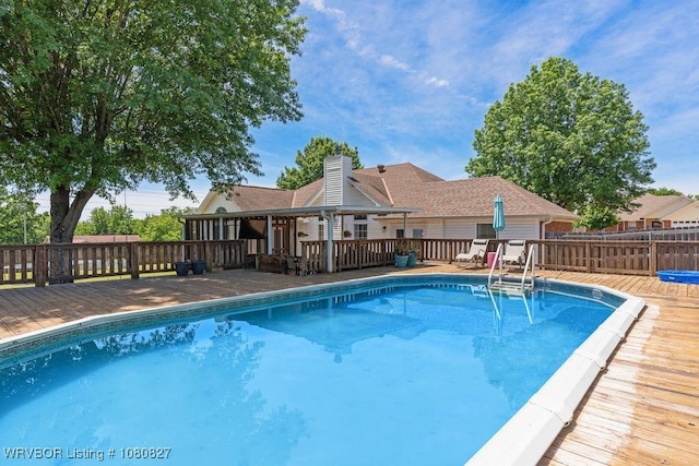 view of pool with a wooden deck