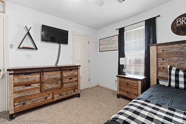 bedroom featuring carpet flooring, baseboards, and a ceiling fan