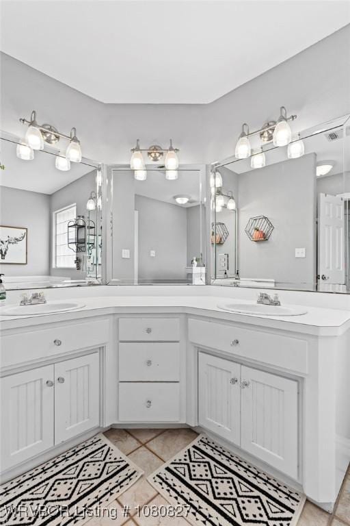 full bathroom with double vanity and tile patterned floors