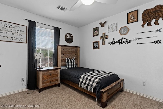 bedroom featuring light carpet and a ceiling fan