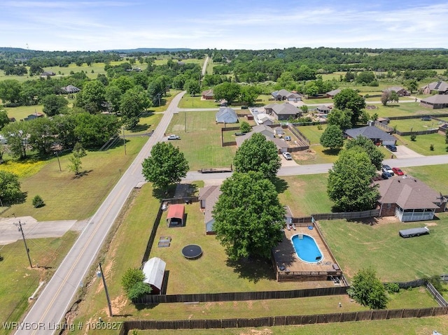 aerial view of property's location featuring a pool