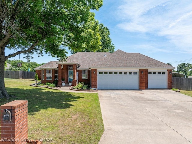 ranch-style home featuring a garage, driveway, brick siding, and a shingled roof