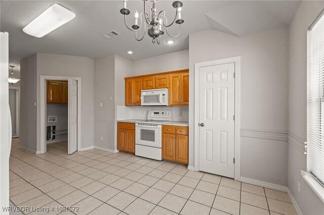 7004 Millennium Dr, Fort Smith, AR 72916 - kitchen featuring white appliances, light tile patterned flooring, a chandelier, light countertops, and recessed lighting