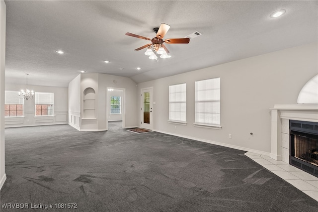 7004 Millennium Dr, Fort Smith, AR 72916 - unfurnished living room featuring carpet, a tile fireplace, ceiling fan, recessed lighting, and a chandelier