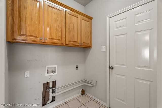 7004 Millennium Dr, Fort Smith, AR 72916 - washroom with cabinet space, hookup for an electric dryer, light tile patterned flooring, and washer hookup
