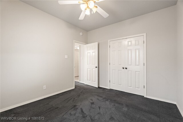 7004 Millennium Dr, Fort Smith, AR 72916 - unfurnished bedroom featuring dark carpet, a closet, and ceiling fan