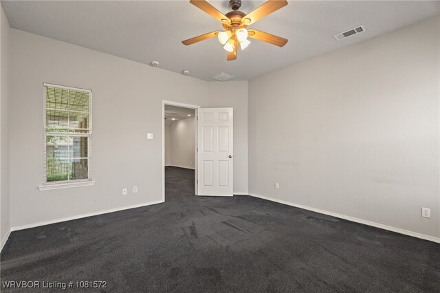 7004 Millennium Dr, Fort Smith, AR 72916 - empty room with dark carpet and a ceiling fan