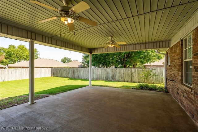 7004 Millennium Dr, Fort Smith, AR 72916 - fenced backyard featuring a ceiling fan and a patio