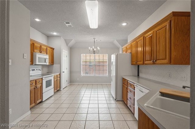 7004 Millennium Dr, Fort Smith, AR 72916 - kitchen with white appliances, backsplash, a chandelier, a textured ceiling, and brown cabinetry