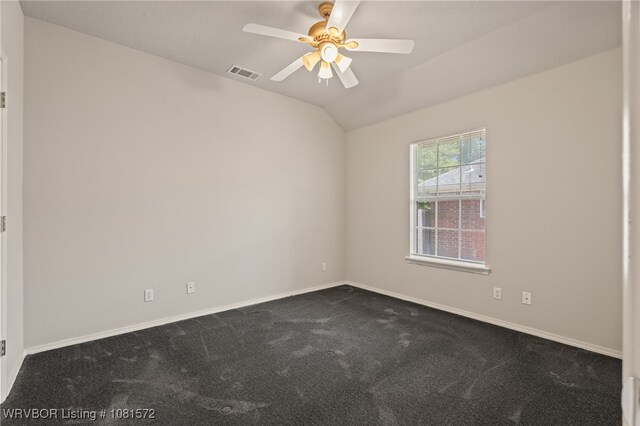7004 Millennium Dr, Fort Smith, AR 72916 - unfurnished room featuring dark colored carpet, a ceiling fan, and vaulted ceiling