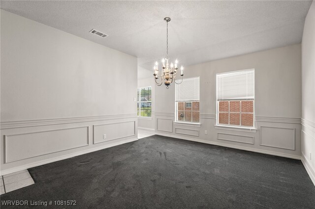 7004 Millennium Dr, Fort Smith, AR 72916 - unfurnished room featuring a chandelier, dark carpet, wainscoting, and a decorative wall