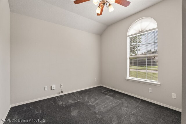 7004 Millennium Dr, Fort Smith, AR 72916 - spare room with ceiling fan, dark colored carpet, and vaulted ceiling