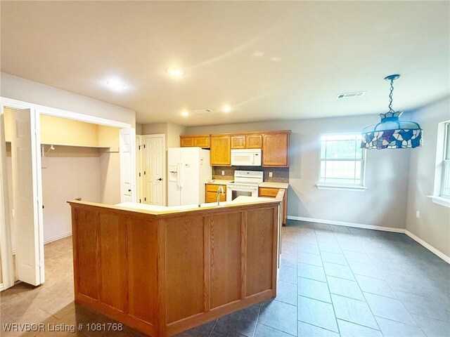 900 S Mattox Ln, Sallisaw, OK 74955 - kitchen with white appliances, recessed lighting, light countertops, tile patterned floors, and pendant lighting