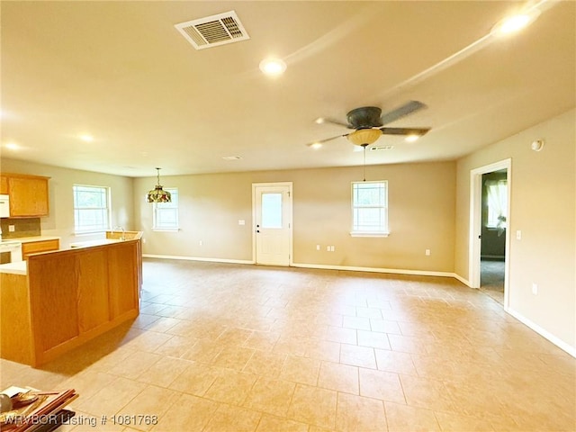 900 S Mattox Ln, Sallisaw, OK 74955 - unfurnished living room with ceiling fan and recessed lighting