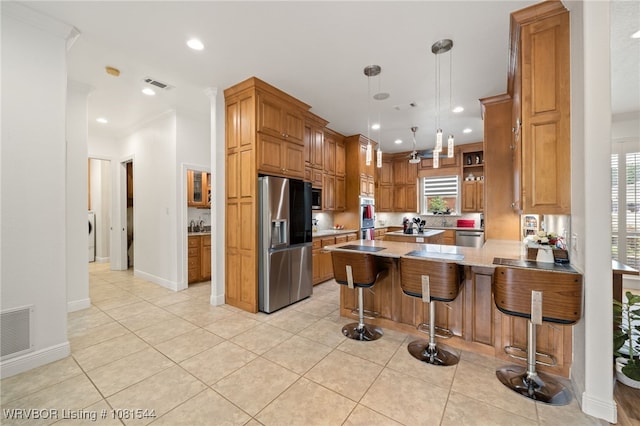 38 Jeffrey Way, Fort Smith, AR 72903 - kitchen featuring appliances with stainless steel finishes, a peninsula, light tile patterned flooring, a kitchen bar, and recessed lighting