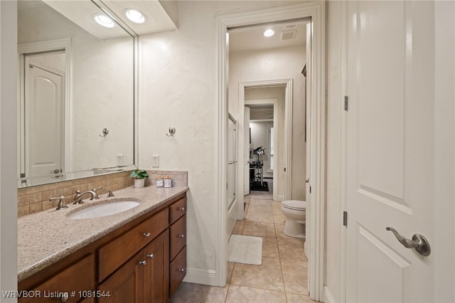 38 Jeffrey Way, Fort Smith, AR 72903 - bathroom with vanity, toilet, tile patterned floors, and baseboards