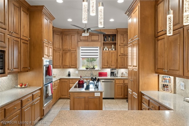 38 Jeffrey Way, Fort Smith, AR 72903 - kitchen featuring stainless steel appliances, tasteful backsplash, light tile patterned floors, brown cabinetry, and recessed lighting