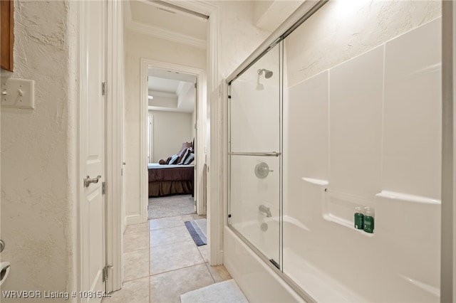 38 Jeffrey Way, Fort Smith, AR 72903 - ensuite bathroom featuring ornamental molding, bath / shower combo with glass door, a textured wall, and tile patterned floors