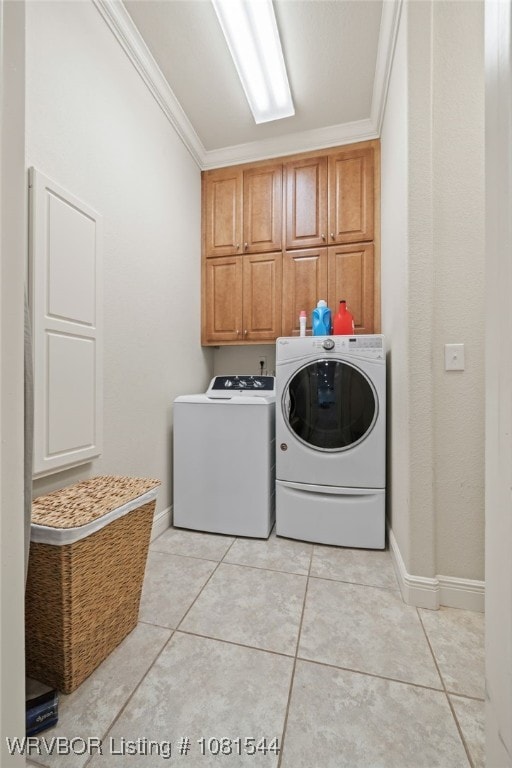 38 Jeffrey Way, Fort Smith, AR 72903 - laundry area featuring cabinet space, crown molding, washer and clothes dryer, light tile patterned floors, and baseboards