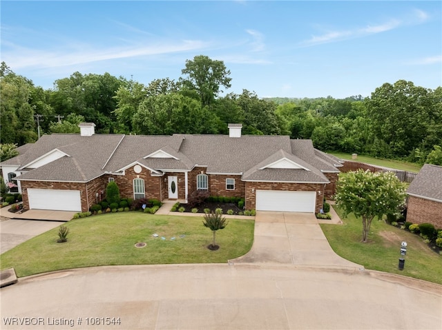 38 Jeffrey Way, Fort Smith, AR 72903 - view of front of property featuring driveway, a chimney, an attached garage, and a front lawn