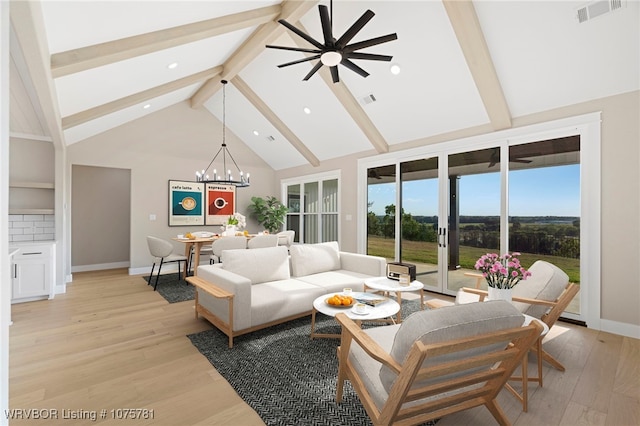 living room featuring beam ceiling, ceiling fan with notable chandelier, light hardwood / wood-style floors, and high vaulted ceiling