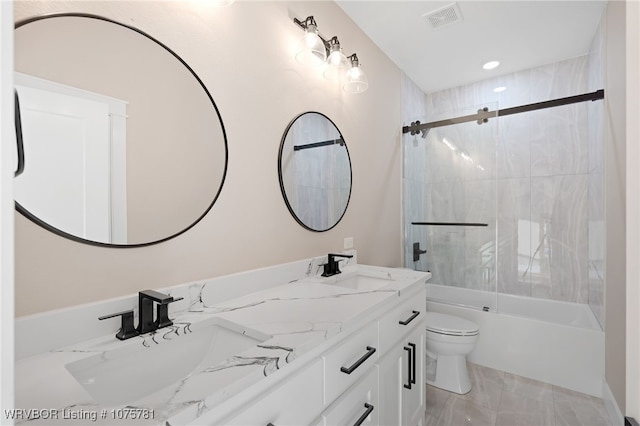 full bathroom with shower / bath combination with glass door, vanity, and toilet