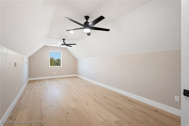 bonus room featuring ceiling fan, light wood-type flooring, and lofted ceiling