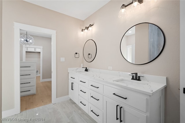 bathroom featuring vanity and an inviting chandelier