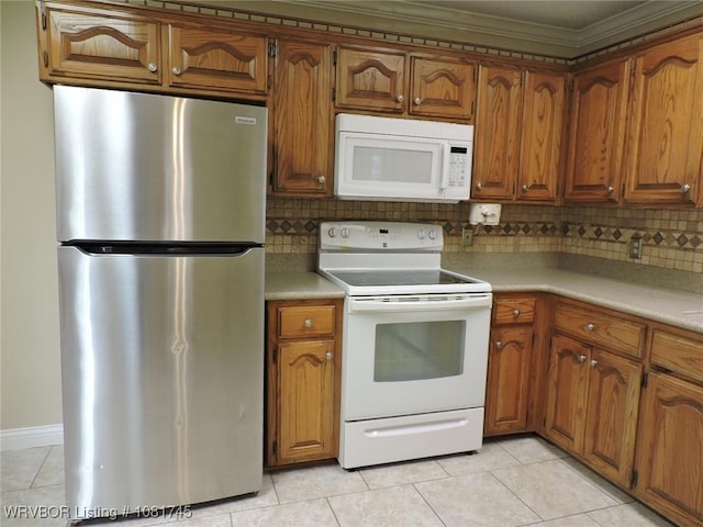 2211 Breckenridge Ter, Greenwood, AR 72936 - kitchen with white appliances, ornamental molding, light tile patterned floors, brown cabinetry, and decorative backsplash