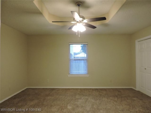 2211 Breckenridge Ter, Greenwood, AR 72936 - empty room featuring dark carpet and a ceiling fan
