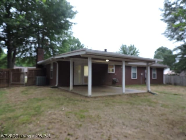 2211 Breckenridge Ter, Greenwood, AR 72936 - back of house featuring a patio area and a chimney