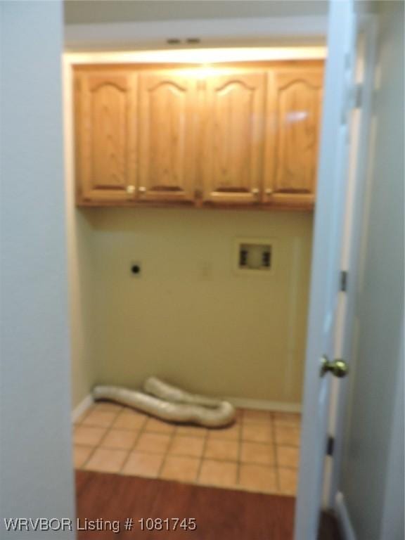2211 Breckenridge Ter, Greenwood, AR 72936 - laundry area with electric dryer hookup, washer hookup, cabinet space, and tile patterned floors
