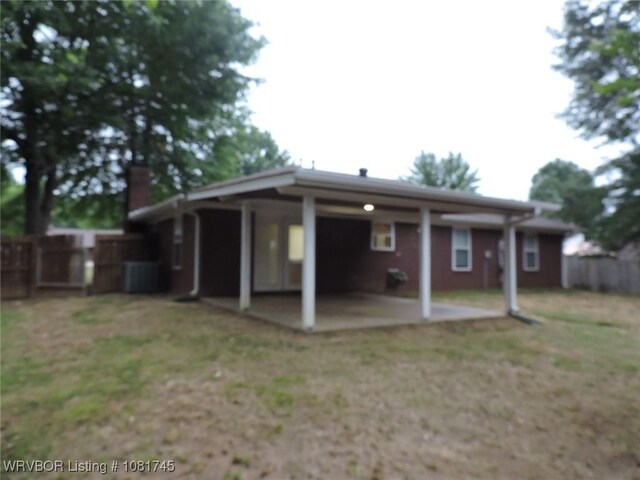 2211 Breckenridge Ter, Greenwood, AR 72936 - back of property with a patio and a chimney