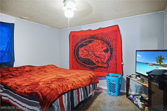 carpeted bedroom featuring ceiling fan and a textured ceiling