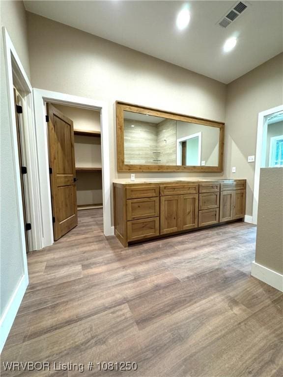 4457 Radio Tower Rd, Van Buren, AR 72956 - full bathroom with vanity, wood finished floors, baseboards, and recessed lighting