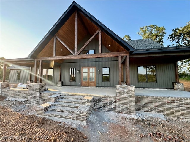 4457 Radio Tower Rd, Van Buren, AR 72956 - rear view of house with french doors, a patio area, and board and batten siding