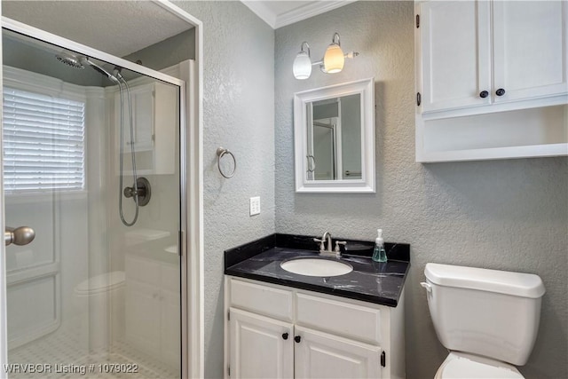 bathroom featuring a shower with door, vanity, and toilet