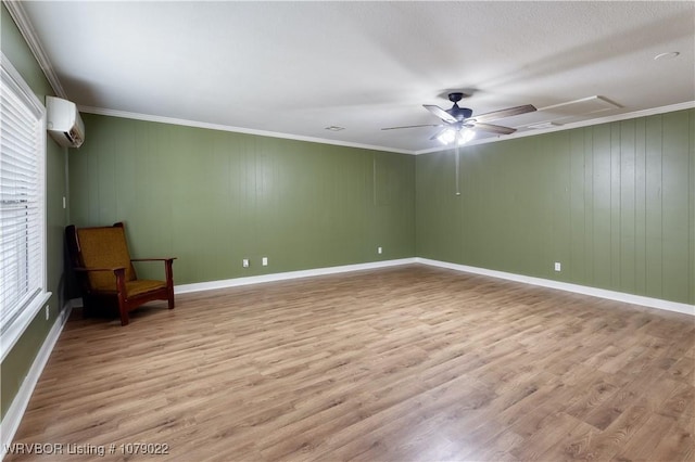 unfurnished room with ceiling fan, crown molding, a wall mounted AC, and light wood-type flooring