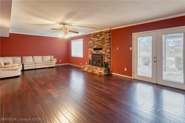 unfurnished living room with ornamental molding, a wealth of natural light, and dark hardwood / wood-style flooring