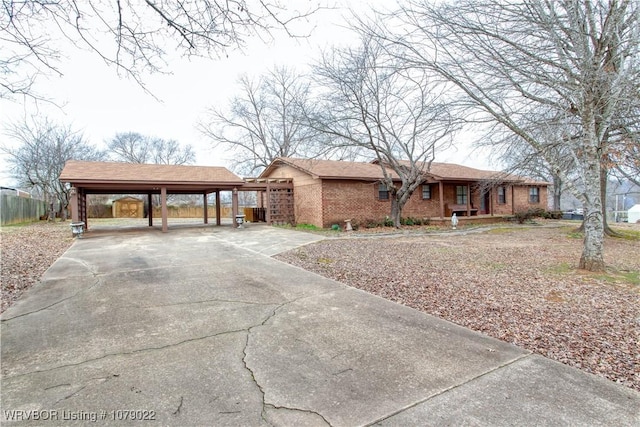 ranch-style house featuring a carport