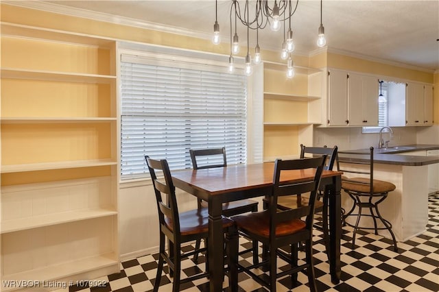 dining room featuring crown molding