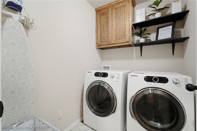 106 Stone Dr, Roland, OK 74954 - laundry area with washing machine and clothes dryer and cabinet space