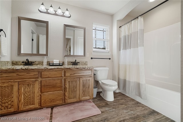 106 Stone Dr, Roland, OK 74954 - full bath featuring double vanity, wood finished floors, and shower / tub combo