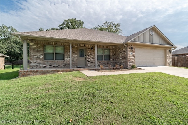 106 Stone Dr, Roland, OK 74954 - ranch-style home featuring covered porch, a garage, concrete driveway, brick siding, and board and batten siding
