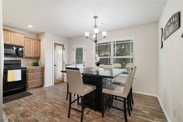 106 Stone Dr, Roland, OK 74954 - dining space featuring a chandelier, dark wood finished floors, and recessed lighting