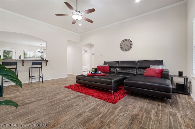 106 Stone Dr, Roland, OK 74954 - living area with arched walkways, wood finished floors, ceiling fan, crown molding, and recessed lighting