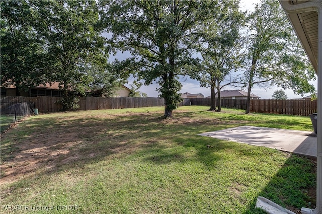106 Stone Dr, Roland, OK 74954 - fenced backyard with a patio area