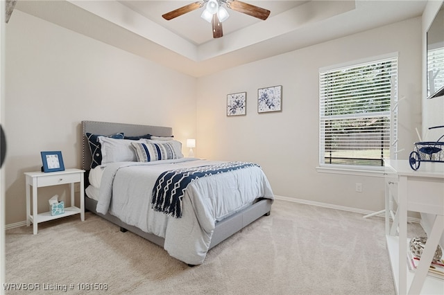 106 Stone Dr, Roland, OK 74954 - carpeted bedroom featuring a raised ceiling and ceiling fan