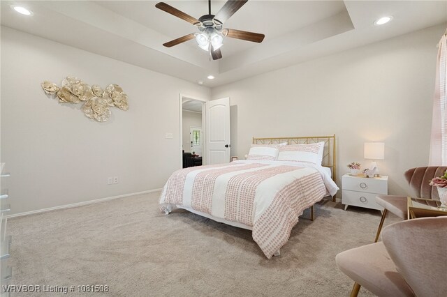 106 Stone Dr, Roland, OK 74954 - bedroom with recessed lighting, carpet, a tray ceiling, and ceiling fan