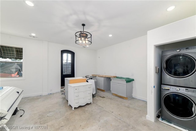 washroom with stacked washer and dryer